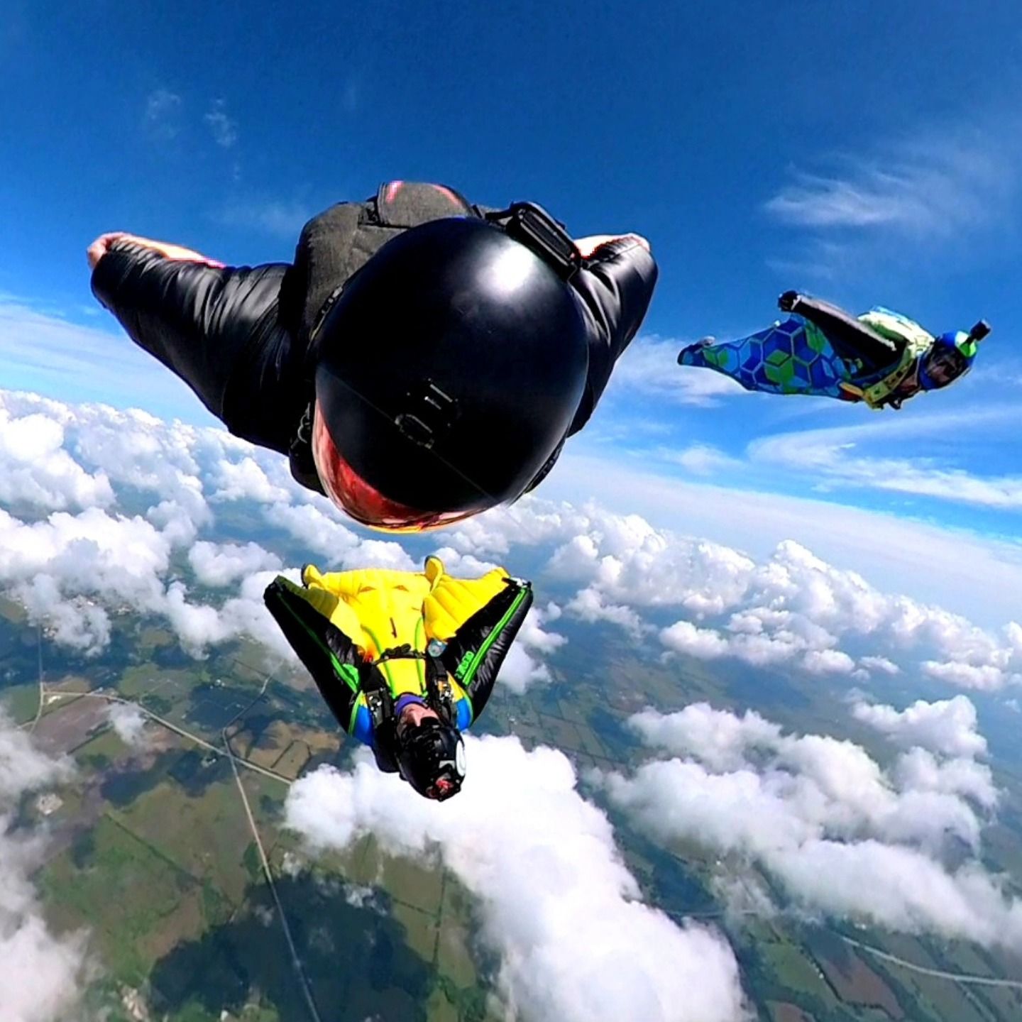 Wingsuit pilots over the clouds
